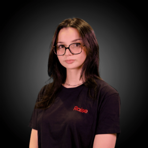 Lola wearing the black Raise TShirt