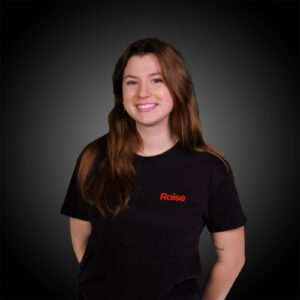 Ines L wearing the black Raise TShirt