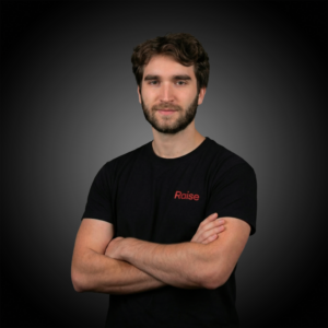 Louis P.P. wearing the black Raise TShirt